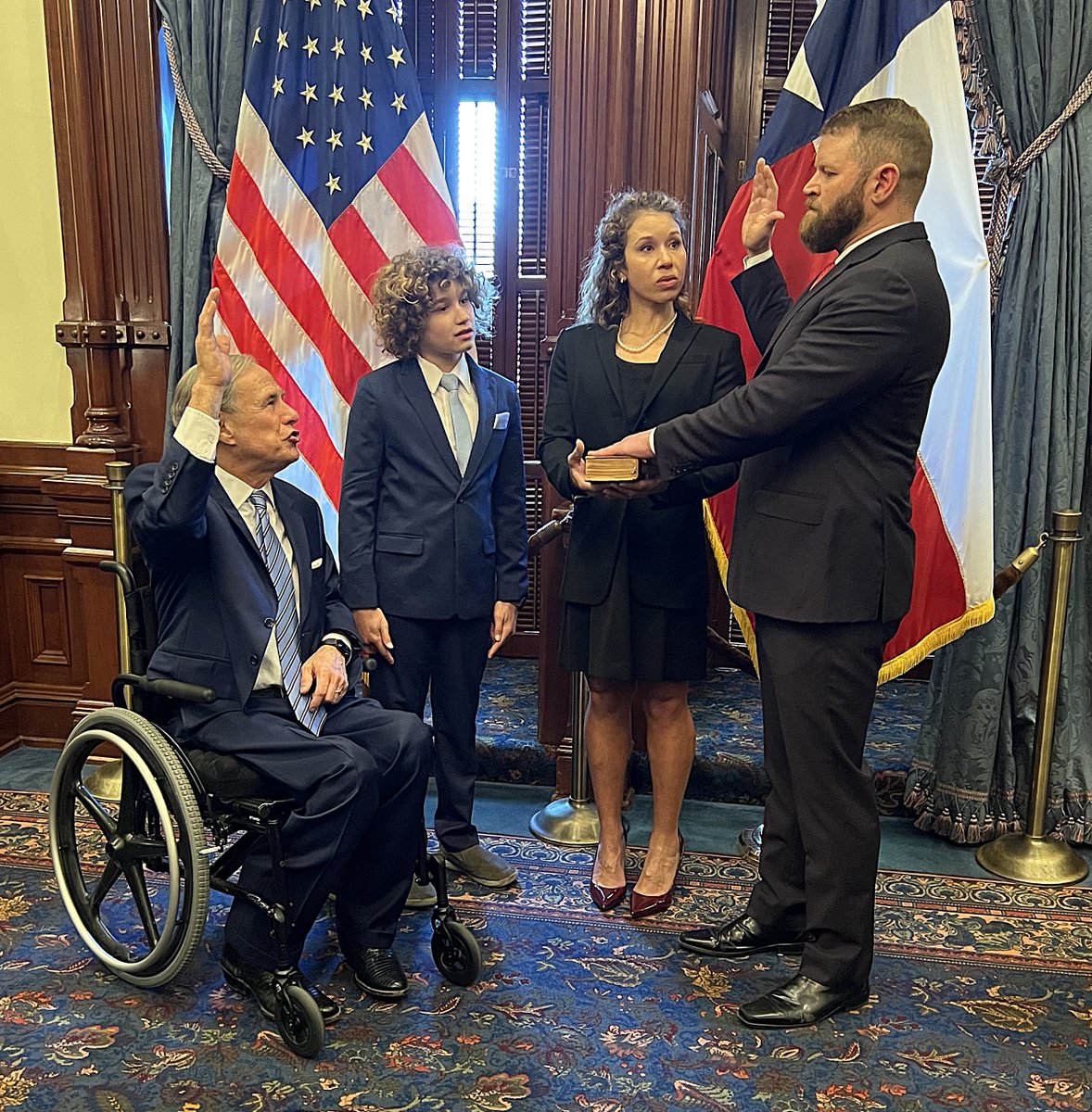 Justice Sullivan being sworn in by Governor Abbott with his family